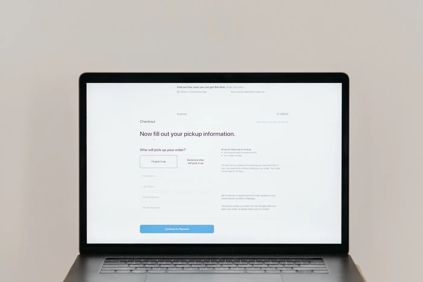 A laptop with a data entry form open on a website